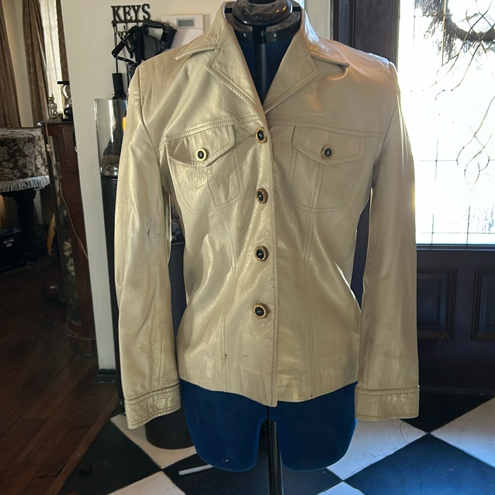 This is a beautiful crème colored leather.... and remember it's St John.